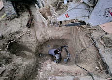 A machine digging a hole in the ground